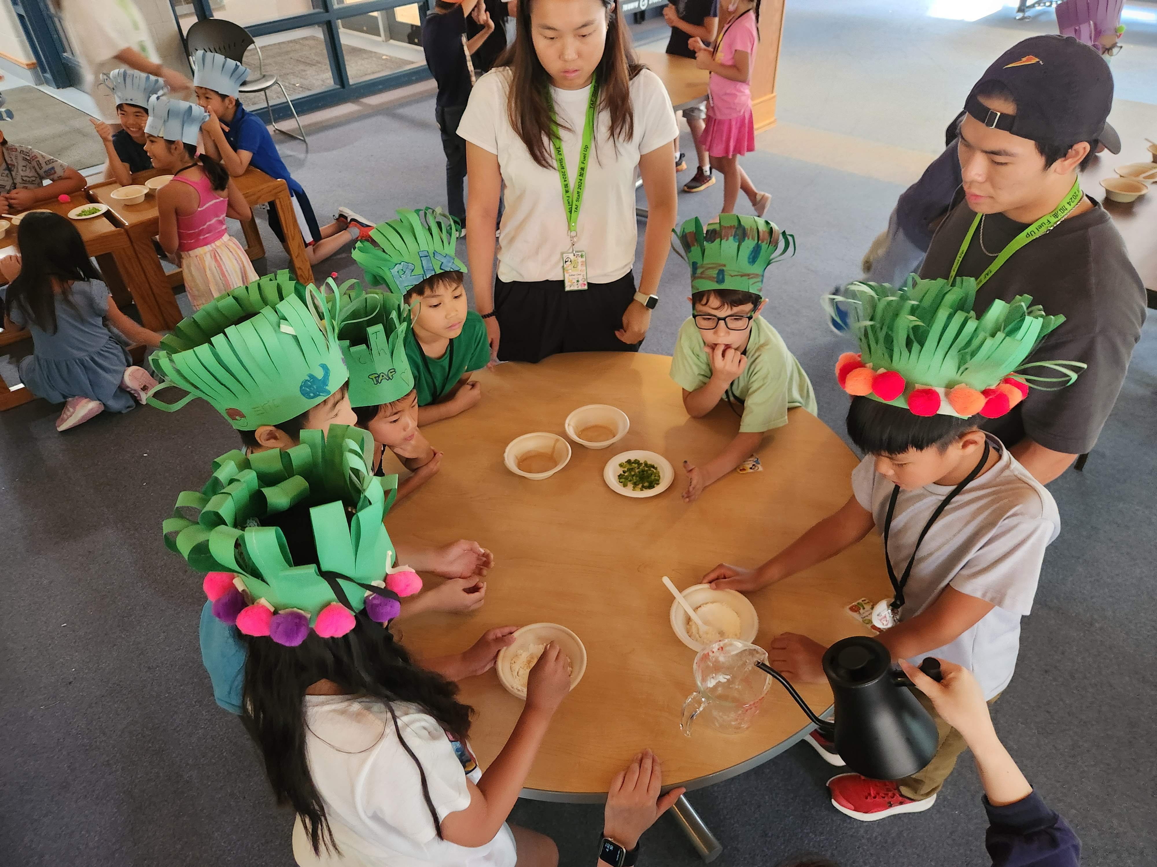 The Sprouts program made green onion pancake (and made their own chef hats too!)